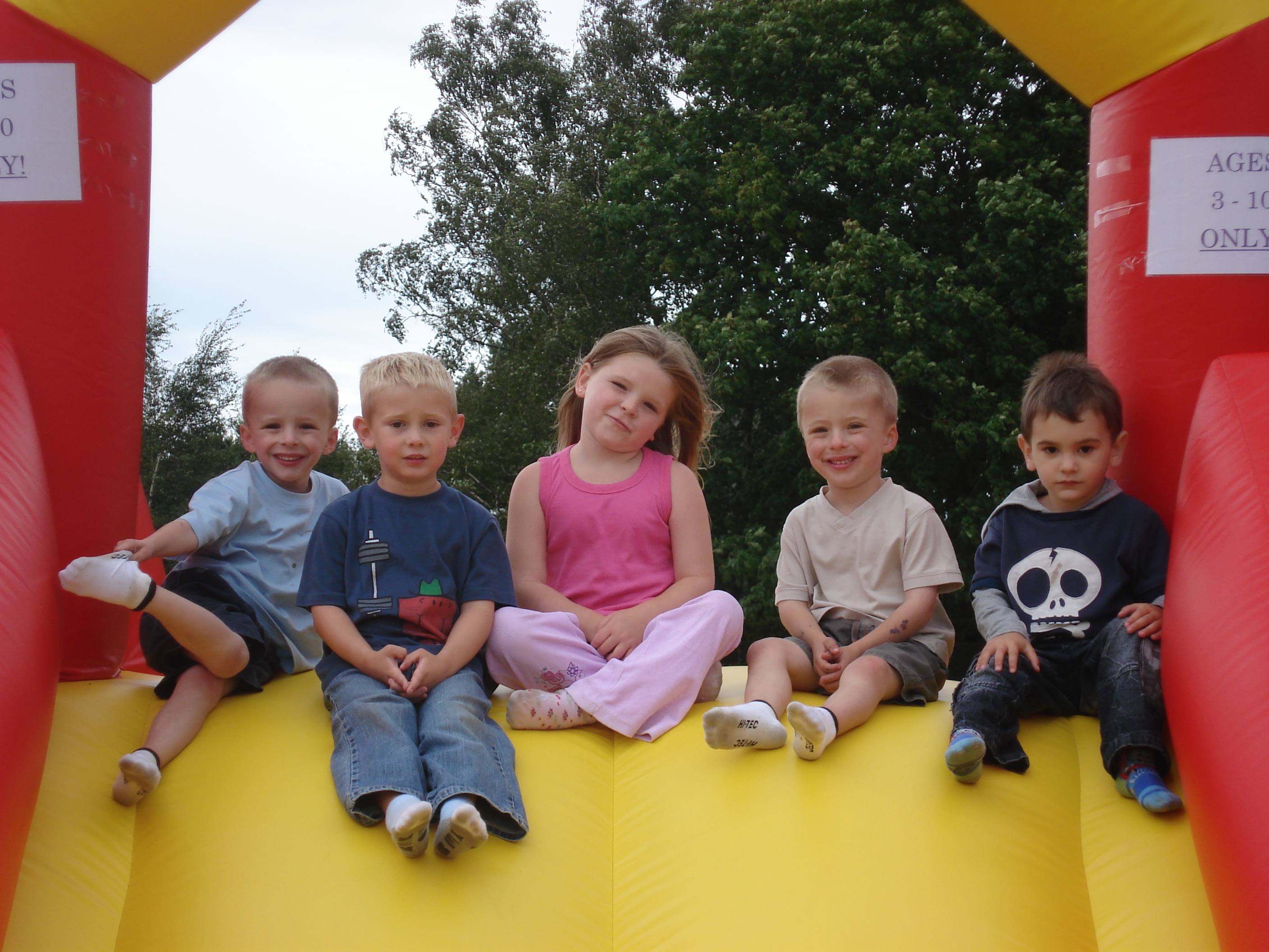 Kids sitting on inflatable